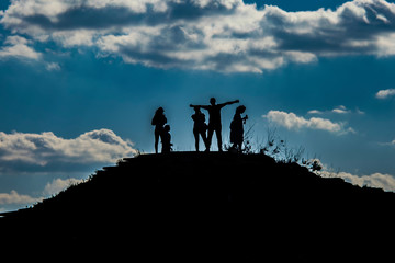 silhouette of a man on top of the mountain