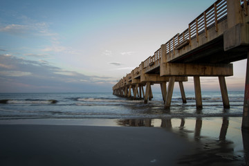 Sunset over Atlantic ocean with pier