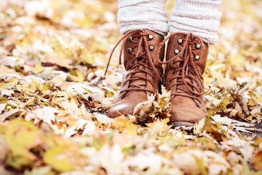 Woman wearing brown boots- partial view