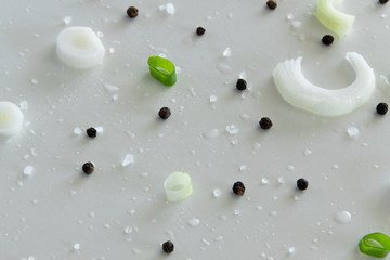 Composition of fresh green vegetables and herbs on white background. Vegetable salad ingredients. Creative food pattern. Flat lay
