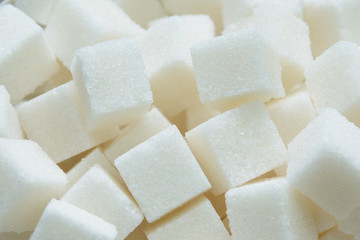 pieces of crystalline sugar in bulk. concept - sugar is white death