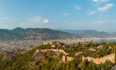 Panorama of the old town overlooking the beach. View of the resort town. Alanya is popular tourist destination in Turkey. Panorama in high resolution observed from Fortress of Alanya