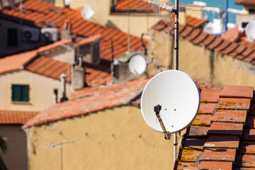 Home TV antennas mounted on a roof.