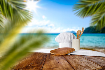 Summer beach and desk of free space with cook hat 