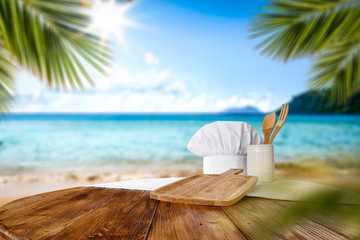 Summer beach and desk of free space with cook hat 