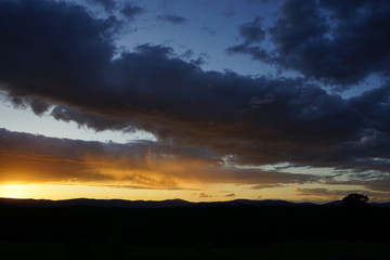Brilliant Sunset with Clouds Over Mountains