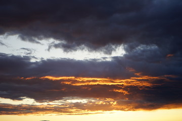 Fototapeta na wymiar Red and Orange Sunset with Clouds