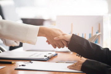 Business people join hands to congratulation the business deal. Business handshake.