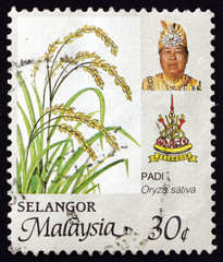 Postage stamp Malaysia 1986 shows rice, state arms and Sultan Salahuddin