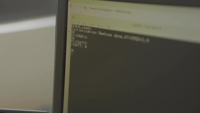 Black Computer screen of an engineer developing software app using Personal Computer and typing code on screen. Programmer coding internet security system for GPS tracker. Close-Up. Test.
