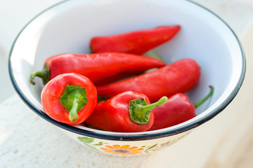 Red sweet pepper lies in a bowl