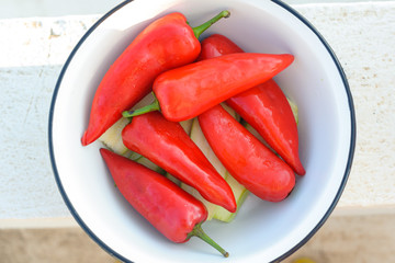 Red sweet pepper lies in a bowl