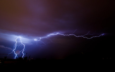 Naklejka na ściany i meble Lightning on the sky during summer storm 