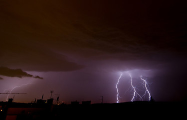 Naklejka na ściany i meble Lightning on the sky during summer storm 