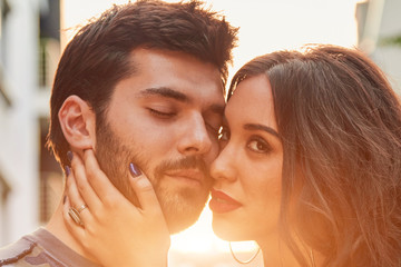 Cute young couple outdoors on the street.
