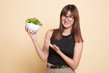 Healthy Asian woman with salad.