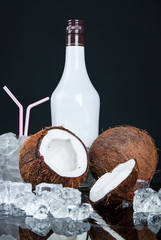 coconut with ice cubes on a black background