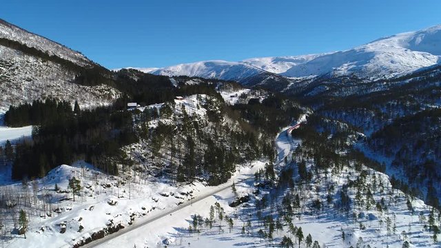 AERIAL. Train Oslo - Bergen in mountains. Hordaland, Norway. 