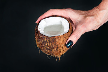 Fototapeta premium tropical coconut on a black background