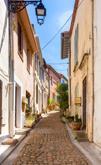 Fototapeta na wymiar Arles. Old narrow street in the historic center of the city.