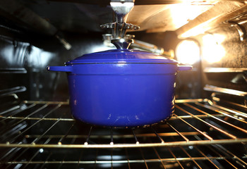 Blue Dutch oven in the oven.