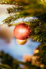 Traditional Christmas tree with Christmas decoration, close up of Christmas bauble. Postcard.