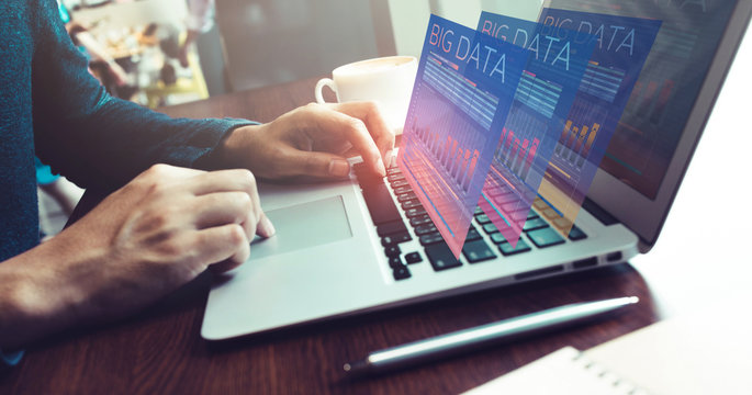 Big data concepts with male working with computer laptop showing data interface for processing.Business  innovation marketing.