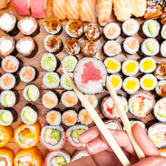 top view of chopsticks with roll over set of sushi