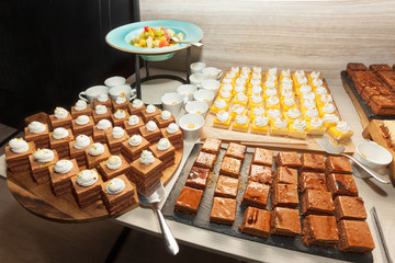 Assortment, variety of sweet cakes on candy buffet