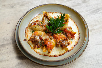 close up of a stuffed italian pasta with pork beef ragout and cheese