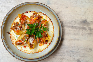 close up of a stuffed italian pasta with pork beef ragout and cheese