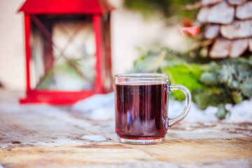Enjoying Christmas time on the Christmas market. Close up of a cup of mulled wine.