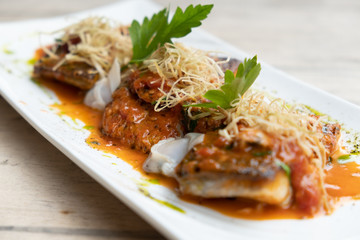 close up of pan seared sea baas snapper fish mediterranean style