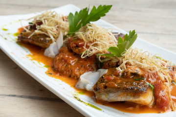 close up of pan seared sea baas snapper fish mediterranean style