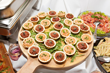 Beef and Turkey pate canapes on wooden board