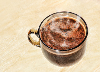 Hot coffee in a glass cup.