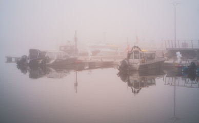 Fishing boats in fog