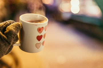 Cup with mulled wine on the christmas market, copy space