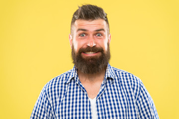 Because everyone deserves to smile. Happy man on yellow background. Bearded man smiling. Caucasian man with mustache and beard hair on unshaven face. Brutal man with long beard and stylish haircut