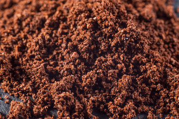 Real natural ground brewed coffee on a dark background, close-up