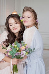 Young beautiful brunette at a bachelorette party. A young woman with a bouquet of flowers,