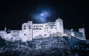 Fortress of Salzburg and the moon: Winterly in the night.