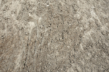 Large pile of construction sand close up as texture and background