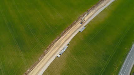 AERIAL: Flying along a new pipeline route being constructed across a large field