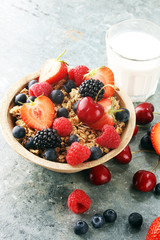 Cereal. Bowl of granola cereals, fruits and milk for breakfast. Muesli with cereals.
