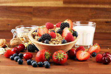 Cereal. Bowl of granola cereals, fruits and milk for breakfast. Muesli with cereals.