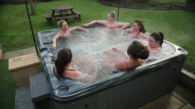 Friends Relaxing in a Hot Tub