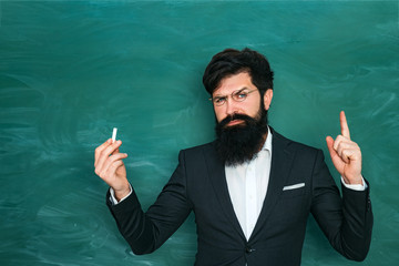 Back to school and happy time. School concept. World teachers day. Professor in class on blackboard background.