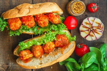 meatballs sandwich (snack with meat and vegetables). food background. top view. copy space