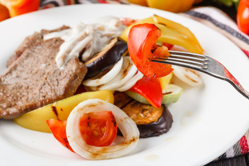 Grilled beef steak and baked vegetables